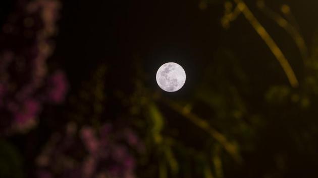 The moon as seen from Goregaon, in Mumbai. (Satyabrata Tripathy / HT Photo)