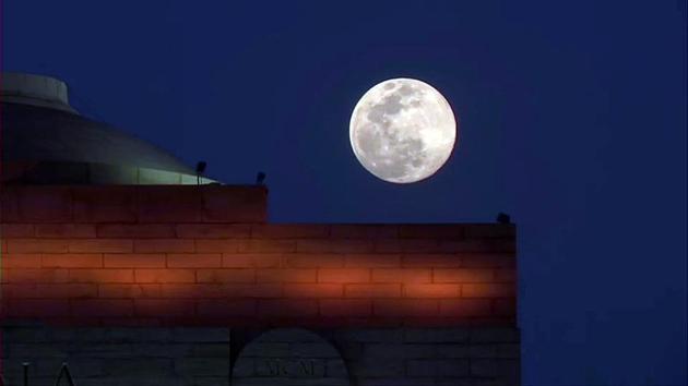 A super pink moon, the biggest and brightest full moon of the year 2020, above India Gate in Delhi. (ANI)