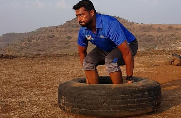 Kale has different tyres of varying weight and also stones of various weights at his terrace, which helps him do weight lifting exercises at home. (HT/PHOTO) Kale has different tyres of varying weight and also stones of various weights at his terrace, which helps him do weight lifting exercises at home. (HT/PHOTO)
