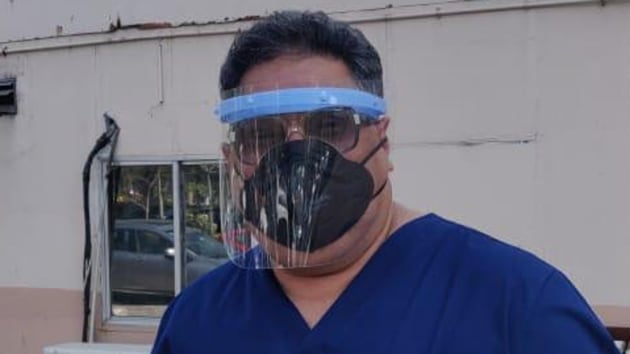 Dr Ashish Kakar, senior consultant, dental surgery, at Apollo Hospital, has also come up with his own design of reusable face masks, which have respirators attached to them.(HT Photo)