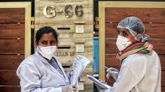Doctors wearing a face mask during a door-to-door verification of people to find out if they have developed any coronavirus disease (COVID-19) symptoms, in Nizamuddin area of New Delhi. (ANI Photo) Doctors wearing a face mask during a door-to-door verification of people to find out if they have developed any coronavirus disease (COVID-19) symptoms, in Nizamuddin area of New Delhi. (ANI Photo)