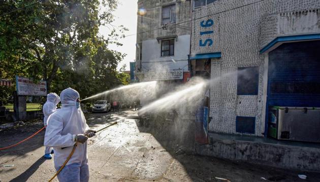 North MCD workers sanitise a locality in Model Town area to contain the spread of coronavirus, during the ongoing nationwide lockdown, in New Delhi. (PTI) North MCD workers sanitise a locality in Model Town area to contain the spread of coronavirus, during the ongoing nationwide lockdown, in New Delhi. (PTI)