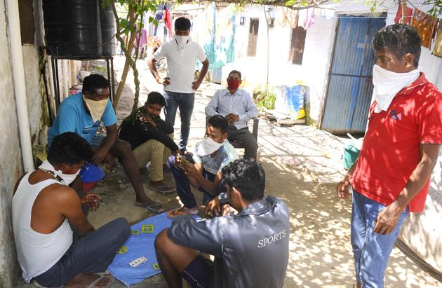 Residents playing cards during the curfew at Kacchi Colony, Dhanas, in Chandigarh. (Anil Dayal/HT) Residents playing cards during the curfew at Kacchi Colony, Dhanas, in Chandigarh. (Anil Dayal/HT)