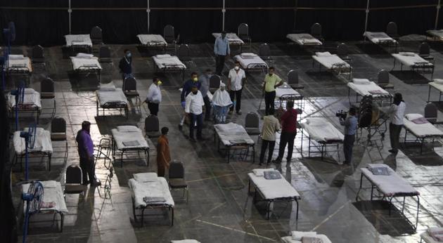 Municipal workers prepare an isolation centre at the NSCI dome in Mumbai on Thursday. (Bhushan Koyande/ /HT PHOTO) Municipal workers prepare an isolation centre at the NSCI dome in Mumbai on Thursday. (Bhushan Koyande/ /HT PHOTO)