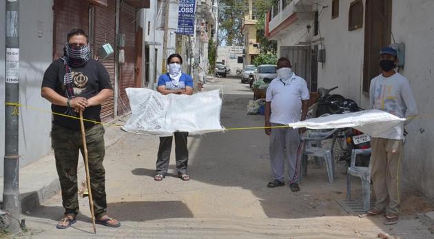 Ludhiana, India – April 09, 2020 : Residents of BRS Nagar Block J put temporary barricade outside their localities in Ludhiana on Thursday. (Gurpreet Singh/HT) Ludhiana, India – April 09, 2020 : Residents of BRS Nagar Block J put temporary barricade outside their localities in Ludhiana on Thursday. (Gurpreet Singh/HT)