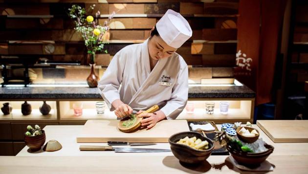 Mizuho Iwai, an apprentice at Sushi Ginza Onodera restaurant, grinds wasabi at the restaurant in Tokyo. A growing number of women in Japan are determined to shatter the opinions of some who believe women can't be sushi chefs. (Behrouz MEHRI / AFP) Mizuho Iwai, an apprentice at Sushi Ginza Onodera restaurant, grinds wasabi at the restaurant in Tokyo. A growing number of women in Japan are determined to shatter the opinions of some who believe women can't be sushi chefs. (Behrouz MEHRI / AFP)