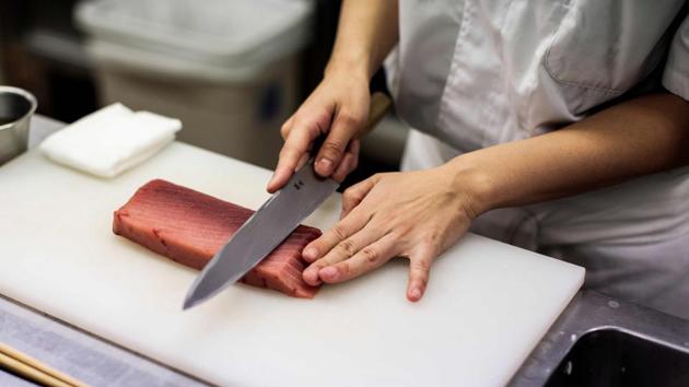Yuki Noguchi, a student at Tokyo Sushi Academy, cuts a fish fillet to make sushi. Sushi chefs have been known to repeat claims that women’s hands are too warm to keep raw fish fresh, or that their periods alter their sense of taste. Others say the job is unsuitable for women because of the long and late hours. (Behrouz MEHRI / AFP) Yuki Noguchi, a student at Tokyo Sushi Academy, cuts a fish fillet to make sushi. Sushi chefs have been known to repeat claims that women’s hands are too warm to keep raw fish fresh, or that their periods alter their sense of taste. Others say the job is unsuitable for women because of the long and late hours. (Behrouz MEHRI / AFP)