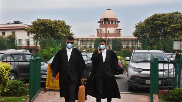 Advocates wearing protective masks as a precautionary measure amid rising coronavirus scare at Supreme Court area, Bhagwan Das road, in New Delhi. (Raj K Raj/HT PHOTO) Advocates wearing protective masks as a precautionary measure amid rising coronavirus scare at Supreme Court area, Bhagwan Das road, in New Delhi. (Raj K Raj/HT PHOTO)