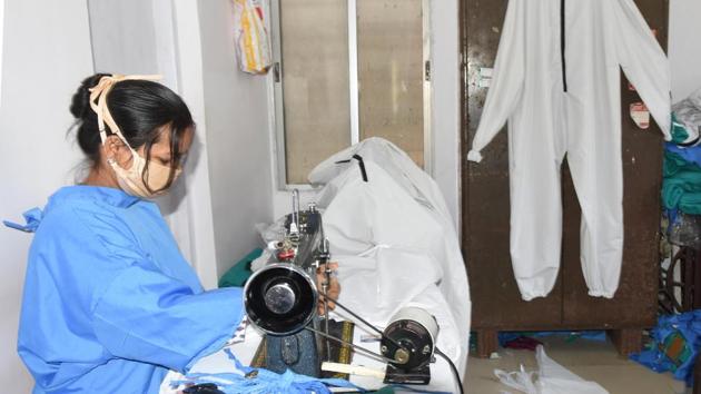 A tailor stitches Covid -19 protective gear. (Diwakar Prasad/ Hindustan Times) A tailor stitches Covid -19 protective gear. (Diwakar Prasad/ Hindustan Times)