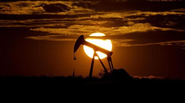 The sun sets behind an idle pump jack near Karnes City, Texas. (AP Photo) The sun sets behind an idle pump jack near Karnes City, Texas. (AP Photo)