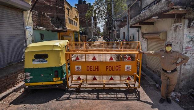 A policeman stands guard outside a lane in Sangam Vihar, one of the 23 designated coronavirus hotspots in Delhi. Chief minister Arvind Kejriwal on Thursday announced ‘Operation SHIELD’, a strategy involving sealing, isolation and tracing, to contain the spread of the coronavirus in containment zones. (Biplov Bhuyan / HT Photo) A policeman stands guard outside a lane in Sangam Vihar, one of the 23 designated coronavirus hotspots in Delhi. Chief minister Arvind Kejriwal on Thursday announced ‘Operation SHIELD’, a strategy involving sealing, isolation and tracing, to contain the spread of the coronavirus in containment zones. (Biplov Bhuyan / HT Photo)
