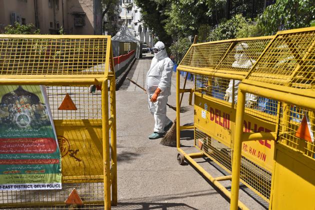 Dakshin Dilli Swachh Initiatives Limited (DDSIL) and SDMC field workers disinfect the Nizamuddin Markaz area. The government has asked residents across the 23 containment zones not to step outside their homes “at any cost”. It also assured that all essential goods would be delivered to their homes. (Burhaan Kinu / HT PHOTO) Dakshin Dilli Swachh Initiatives Limited (DDSIL) and SDMC field workers disinfect the Nizamuddin Markaz area. The government has asked residents across the 23 containment zones not to step outside their homes “at any cost”. It also assured that all essential goods would be delivered to their homes. (Burhaan Kinu / HT PHOTO)