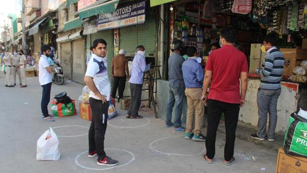 People shop for essentials at a grocery store while maintaining social distance in Gurugram, on April 9. (Yogendra Kumar/HT Photo) People shop for essentials at a grocery store while maintaining social distance in Gurugram, on April 9. (Yogendra Kumar/HT Photo)