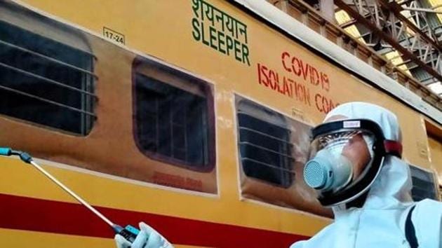 Railway worker sprays disinfectant on COVID19 isolation coach during a government-imposed nationwide lockdown as a preventive measure against the COVID-19 coronavirus, in Kolkata on Wednesday.(ANI) Railway worker sprays disinfectant on COVID19 isolation coach during a government-imposed nationwide lockdown as a preventive measure against the COVID-19 coronavirus, in Kolkata on Wednesday.(ANI)