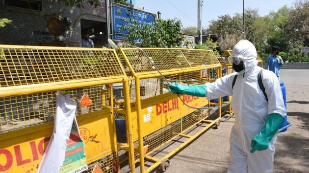 Public Health Department, SDMC sanitizing and Contractual workers (DDSIL Dakshin dilli swachh initiative Ltd) of SMCD cleaning the area inside and outside of Nizamuddin Markaz amid coronavirus lockdown. (Photo by Ajay Aggarwal/Hindustan Times) Public Health Department, SDMC sanitizing and Contractual workers (DDSIL Dakshin dilli swachh initiative Ltd) of SMCD cleaning the area inside and outside of Nizamuddin Markaz amid coronavirus lockdown. (Photo by Ajay Aggarwal/Hindustan Times)