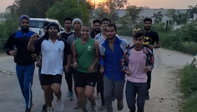 Groups of youths can be seen working on their exercise regimen and running on village roads in western Uttar Pradesh every morning, some taking adequate precautions while others are nonchalant. (HT Photo) Groups of youths can be seen working on their exercise regimen and running on village roads in western Uttar Pradesh every morning, some taking adequate precautions while others are nonchalant. (HT Photo)