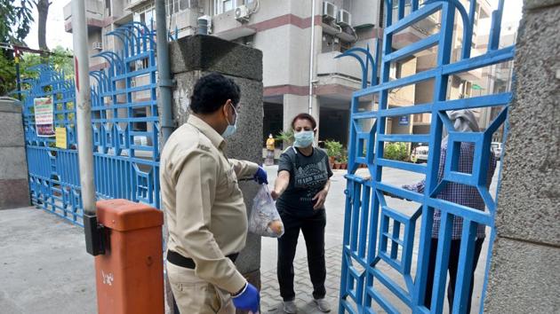 Residents of the Vardhaman Apartments containment zone have good delivered to the society gates, on day seventeen of the 21 day nationwide lockdown to limit the coronavirus in Mayur Vihar (Sushil Kumar/HT PHOTO) Residents of the Vardhaman Apartments containment zone have good delivered to the society gates, on day seventeen of the 21 day nationwide lockdown to limit the coronavirus in Mayur Vihar (Sushil Kumar/HT PHOTO)