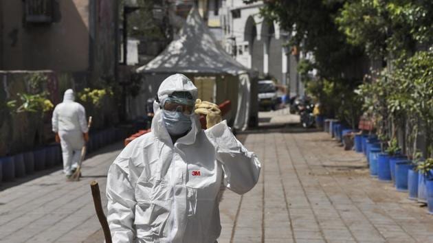 Dakshin Dilli Swachh Initiatives Limited (DDSIL) and SDMC public health department field workers arrive to chemically disinfect the Nizamuddin Markaz building, one of the twenty hotspot areas sealed to curb the spread of coronavirus, on day sixteen of the 21-day nationwide lockdown, in New Delhi. (Burhaan Kinu/HT PHOTO) Dakshin Dilli Swachh Initiatives Limited (DDSIL) and SDMC public health department field workers arrive to chemically disinfect the Nizamuddin Markaz building, one of the twenty hotspot areas sealed to curb the spread of coronavirus, on day sixteen of the 21-day nationwide lockdown, in New Delhi. (Burhaan Kinu/HT PHOTO)
