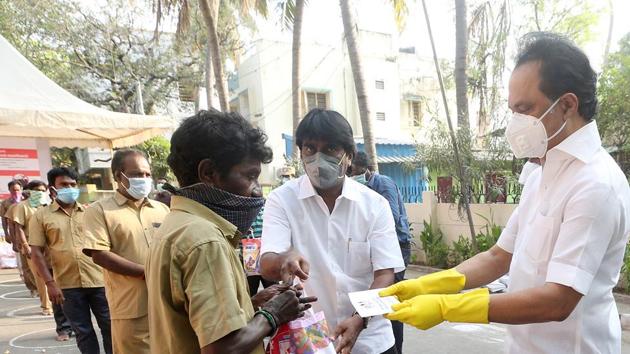 DMK President MK Stalin wears a protective mask as he distributes essential commodities to needy people, during a nationwide lockdown imposed in the wake of coronavirus pandemic, in Chennai. (ANI) DMK President MK Stalin wears a protective mask as he distributes essential commodities to needy people, during a nationwide lockdown imposed in the wake of coronavirus pandemic, in Chennai. (ANI)