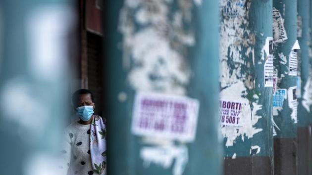 A woman wearing face masks to protect against coronavirus, walks on the street in downtown Johannesburg, South Africa, Wednesday, April 8, 2020. (AP photo) A woman wearing face masks to protect against coronavirus, walks on the street in downtown Johannesburg, South Africa, Wednesday, April 8, 2020. (AP photo)