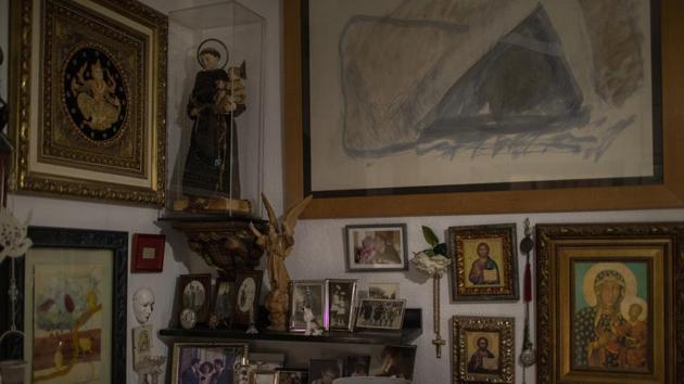 Religious icons decorate a bedroom at Joan Olmedillo’s home. Barcelona’s elderly are suffering at home, alone and more isolated than ever. Few know for sure if they have the virus, but the threat that they might catch it — even from the visiting medical teams they need — has only heightened their anxiety. (Emilio Morenatti / AP) Religious icons decorate a bedroom at Joan Olmedillo’s home. Barcelona’s elderly are suffering at home, alone and more isolated than ever. Few know for sure if they have the virus, but the threat that they might catch it — even from the visiting medical teams they need — has only heightened their anxiety. (Emilio Morenatti / AP)