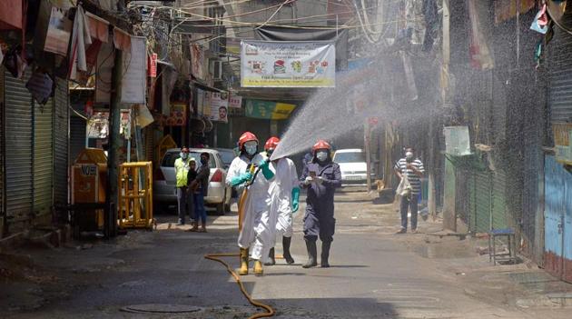 Firefighters spray disinfectants at Zakir Nagar area during the nationwide lockdown to curb the spread of coronavirus, in New Delhi, Saturday, April 11, 2020.(PTI photo)