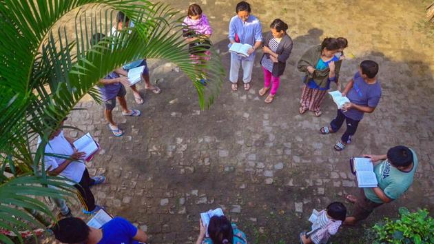 Christian devotees sing a Gospel hymn during a special Easter fellowship outside their house, amid a three-week nationwide COVID-19 lockdown, in Dimapur, Nagaland. (PTI)