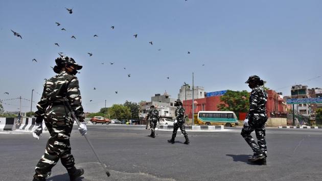 Central Reserve Police Force (CRPF) personnel patrol in the Geeta Colony on the day eighteen of the 21-day nationwide lockdown to curb the spread of coronavirus, in New Delhi, on Saturday, April 11, 2020.(Raj K Raj/HT PHOTO) Central Reserve Police Force (CRPF) personnel patrol in the Geeta Colony on the day eighteen of the 21-day nationwide lockdown to curb the spread of coronavirus, in New Delhi, on Saturday, April 11, 2020.(Raj K Raj/HT PHOTO)
