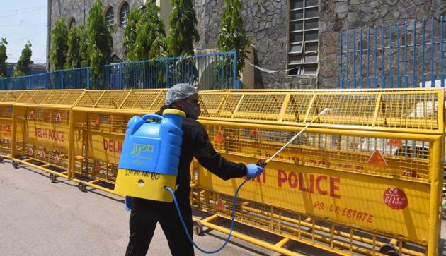 A municipal worker sprays disinfectant while sanitizing the Chandni Mahal containment zone area near Turkman Gate,. (Sonu Mehta/HT PHOTO) A municipal worker sprays disinfectant while sanitizing the Chandni Mahal containment zone area near Turkman Gate,. (Sonu Mehta/HT PHOTO)