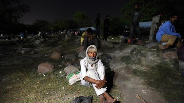 A homeless man seen after fire broke at a shelter home near Nigambodh Ghat, Kashmiri Gate on day eighteen of the 21 day nationwide lockdown to check the spread of coronavirus, in New Delhi.(Amal KS/HT PHOTO)