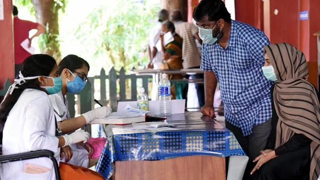 Doctors consulting patients in special fever desk at Ernakulam General hospital during the nationwide lockdown, in wake of coronavirus pandemic, in Kochi on Wednesday. (ANI) Doctors consulting patients in special fever desk at Ernakulam General hospital during the nationwide lockdown, in wake of coronavirus pandemic, in Kochi on Wednesday. (ANI)