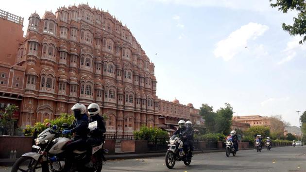 The Nirbhaya Squad, an all women police patrol team, conducts a flag march in front of a deserted Hawa Mahal on day fifteen of the nationwide lockdown, in Jaipur. (ANI) The Nirbhaya Squad, an all women police patrol team, conducts a flag march in front of a deserted Hawa Mahal on day fifteen of the nationwide lockdown, in Jaipur. (ANI)