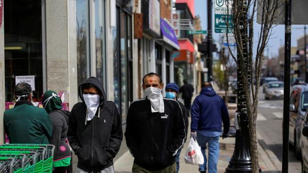 Pedestrians walk along Devon Avenue during the global outbreak of coronavirus disease (COVID-19) in Chicago, Illinois, U.S. April 11, 2020.(REUTERS)