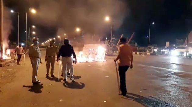 Police force and Rapid action force deployed after migrant workers clashed with security personnel in Surat on Friday.(ANI) Police force and Rapid action force deployed after migrant workers clashed with security personnel in Surat on Friday.(ANI)