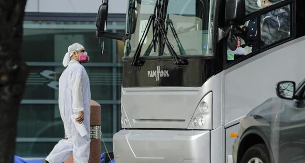 A medical worker and a bus driver wear personal protective equipment outside of Kings County hospital Friday, April 10, 2020, in the Brooklyn borough of New York. (AP) A medical worker and a bus driver wear personal protective equipment outside of Kings County hospital Friday, April 10, 2020, in the Brooklyn borough of New York. (AP)