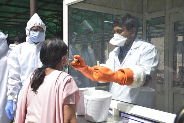 Samples being collected at a centre in Ghaziabad. The first study, by Chinese medical experts in the Clinical Infectious Diseases journal, found that 14.5% of 172 patients discharged from the Shenzhen Third People’s Hospital between Jan 23 and Feb 21 tested positive again.(HT Photo) Samples being collected at a centre in Ghaziabad. The first study, by Chinese medical experts in the Clinical Infectious Diseases journal, found that 14.5% of 172 patients discharged from the Shenzhen Third People’s Hospital between Jan 23 and Feb 21 tested positive again.(HT Photo)