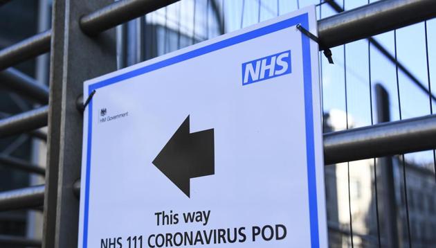 A sign indicating a Coronavirus Pod is seen outside the London University College Hospital, in London. (AP) A sign indicating a Coronavirus Pod is seen outside the London University College Hospital, in London. (AP)