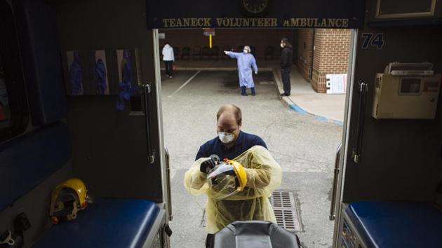 An emergency medical technician (EMT) removes and disinfects personal protective equipment (PPE) after transporting a patient in Teaneck, New Jersey. “New York City had all the preconditions that would support the idea that it was going to be hit very hard,” Irwin Redlener, public health professor and expert in disaster preparedness at Columbia University told AFP. (Angus Mordant / Bloomberg) An emergency medical technician (EMT) removes and disinfects personal protective equipment (PPE) after transporting a patient in Teaneck, New Jersey. “New York City had all the preconditions that would support the idea that it was going to be hit very hard,” Irwin Redlener, public health professor and expert in disaster preparedness at Columbia University told AFP. (Angus Mordant / Bloomberg)