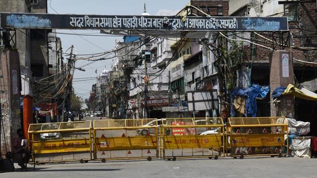 Police barricades at the entrance to Sadar area -- identified as one of the containment zones. People are not allowed to step out of their houses and authorities are delivering essentials to their homes in these zones under hard lockdowns. CM Arvind Kejriwal said the Delhi government was treating the containment areas as “red zones”. (Vipin Kumar / HT Photo) Police barricades at the entrance to Sadar area -- identified as one of the containment zones. People are not allowed to step out of their houses and authorities are delivering essentials to their homes in these zones under hard lockdowns. CM Arvind Kejriwal said the Delhi government was treating the containment areas as “red zones”. (Vipin Kumar / HT Photo)