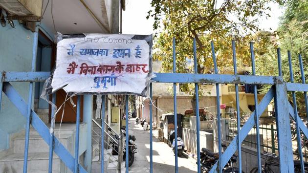 A poster put up by residents that reads 'Main samaj ka dushman hoon, Main bina kaam ke bahar niklunga' (I am an enemy of society, I will step out unnecessarily) at an entrance to the containment zone at Khichripur. (Mohd Zakir / HT PHOTO) A poster put up by residents that reads 'Main samaj ka dushman hoon, Main bina kaam ke bahar niklunga' (I am an enemy of society, I will step out unnecessarily) at an entrance to the containment zone at Khichripur. (Mohd Zakir / HT PHOTO)