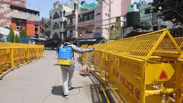 A municipal worker sprays disinfectant while sanitizing the Chandni Mahal containment zone, on day eighteen of the 21 day nationwide lockdown. Delhi has added 10 new containment areas to arrest coronavirus cases, which climbed to 1,154 – the national capital reported 85 fresh infections and five deaths on Sunday. (Sonu Mehta / HT Photo) A municipal worker sprays disinfectant while sanitizing the Chandni Mahal containment zone, on day eighteen of the 21 day nationwide lockdown. Delhi has added 10 new containment areas to arrest coronavirus cases, which climbed to 1,154 – the national capital reported 85 fresh infections and five deaths on Sunday. (Sonu Mehta / HT Photo)