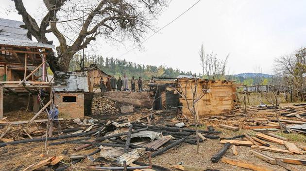 Locals look on at damaged properties following ceasefire violation by Pakistani forces yesterday, in north Kashmir's Kupwara district, Monday, April 13, 2020. Three civilians, a woman and two minors, were killed in the firing.(PTI) Locals look on at damaged properties following ceasefire violation by Pakistani forces yesterday, in north Kashmir's Kupwara district, Monday, April 13, 2020. Three civilians, a woman and two minors, were killed in the firing.(PTI)