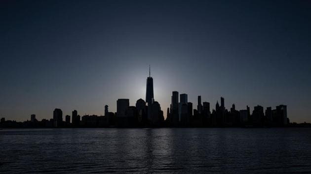 A view of the Manhattan skyline, in New York City. The American city has more coronavirus cases than Spain and Italy and accounts for around half of all deaths in the United States. The total number of coronavirus cases in NYC stands at over 104,410 as of April 12 with 6,898 virus related deaths. (Johannes Eisele / AFP) A view of the Manhattan skyline, in New York City. The American city has more coronavirus cases than Spain and Italy and accounts for around half of all deaths in the United States. The total number of coronavirus cases in NYC stands at over 104,410 as of April 12 with 6,898 virus related deaths. (Johannes Eisele / AFP)