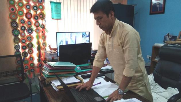 Manipur education minister Dr Th Radheshyam launching the e-format of comic books in his Imphal office. (DIPR Manipur)