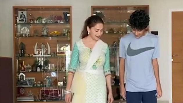 Madhuri Dixit teaches some dance moves to son Arin. Madhuri Dixit teaches some dance moves to son Arin.
