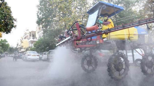 A trail sanitation drive in Mayur Vihar Phase II, in New Delhi using a large-scale disinfection machine meant to deployed in the national capital’s red zones. With the mass identification and isolation of cluster cases across the country, the focus has now shifted to how well the government can contain and localise the infections. (Ajay Aggarwal / HT Photo)