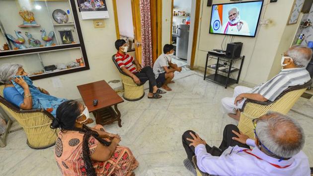 A family watches Prime Minister Narendra Modi's address to the nation in Beawar, Rajasthan. In his third televised address to the nation in less than a month, the Prime Minister on Tuesday extended the lockdown to May 3 but made it clear that an economic revival rested on an April 20 review. (PTI)