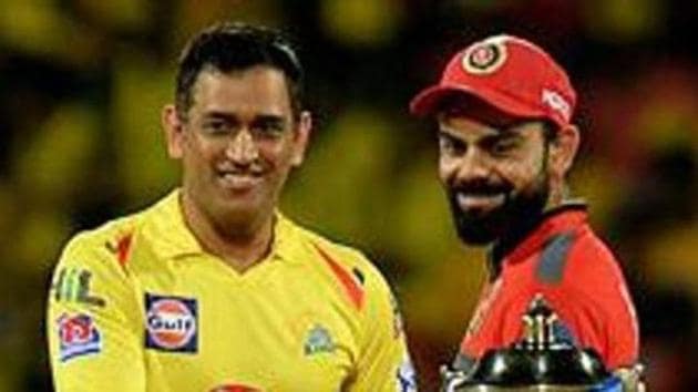 (FILES) In this file photo taken on March 24, 2019, Chennai Super Kings cricket captain Mahendra Singh Dhoni and Royal Challengers Bangalore cricket captain Virat Kohli (R) gesture beside IPL trophy ahead of the Indian Premier League (IPL) Twenty20 cricket match between Chennai Super Kings and Royal Challengers Bangalore at the M. A. Chidhambaram Stadium in Chennai.(AFP) (FILES) In this file photo taken on March 24, 2019, Chennai Super Kings cricket captain Mahendra Singh Dhoni and Royal Challengers Bangalore cricket captain Virat Kohli (R) gesture beside IPL trophy ahead of the Indian Premier League (IPL) Twenty20 cricket match between Chennai Super Kings and Royal Challengers Bangalore at the M. A. Chidhambaram Stadium in Chennai.(AFP)