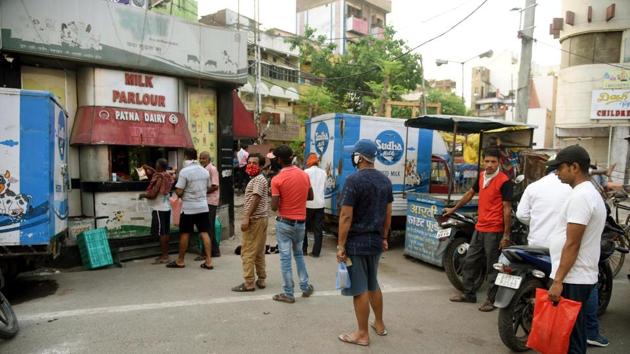 People queue up outside a milk booth while maintaining social distance, on Monday. (Santosh Kumar/HT Photo) People queue up outside a milk booth while maintaining social distance, on Monday. (Santosh Kumar/HT Photo)