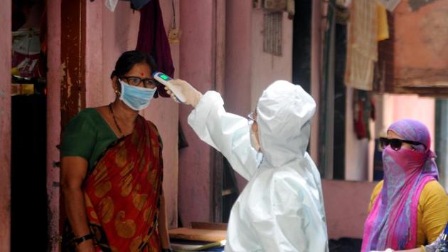 Medical practitioners use thermal screening to check the temperature of people in Kalyan wadi Netaji co-operative housing society as a precautionary measure against the spread of the coronavirus disease Covid-19, in Mumbai on Monday. (ANI Photo) Medical practitioners use thermal screening to check the temperature of people in Kalyan wadi Netaji co-operative housing society as a precautionary measure against the spread of the coronavirus disease Covid-19, in Mumbai on Monday. (ANI Photo)